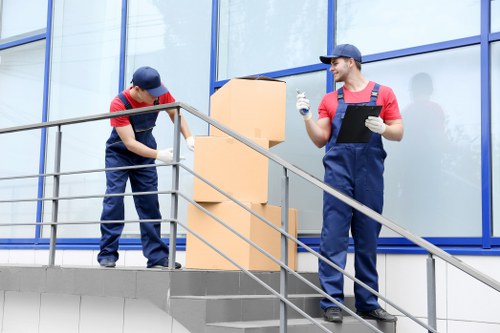 Professional house removals planning in Islington with moving boxes and van