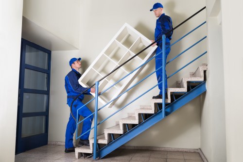 Moving van and helper during a booked house removal service