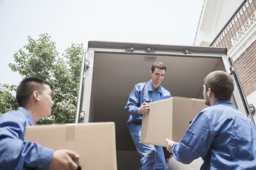 Professional movers loading furniture for an Islington same day removal
