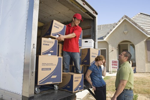 Loading furniture into a removal truck near an Islington property