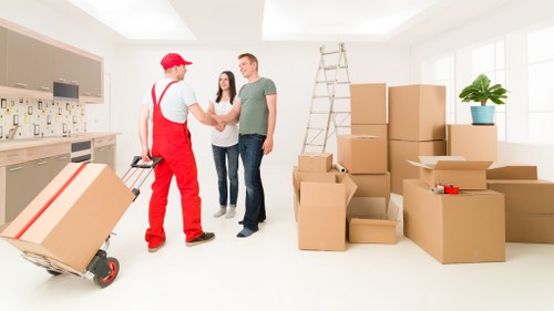 Moving boxes and household items ready for man with van removal in Islington