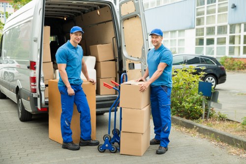 Packed moving boxes ready for transport in Islington