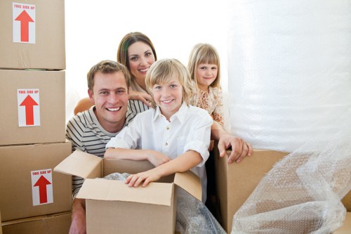 Professional movers loading boxes into a van in Islington
