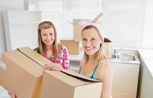 Office furniture and boxes arranged for a commercial relocation