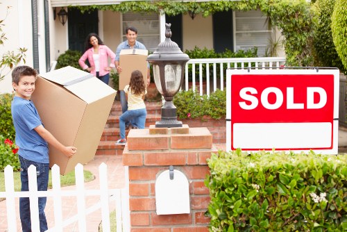 Organised flat moving service with boxes and furniture ready for transport